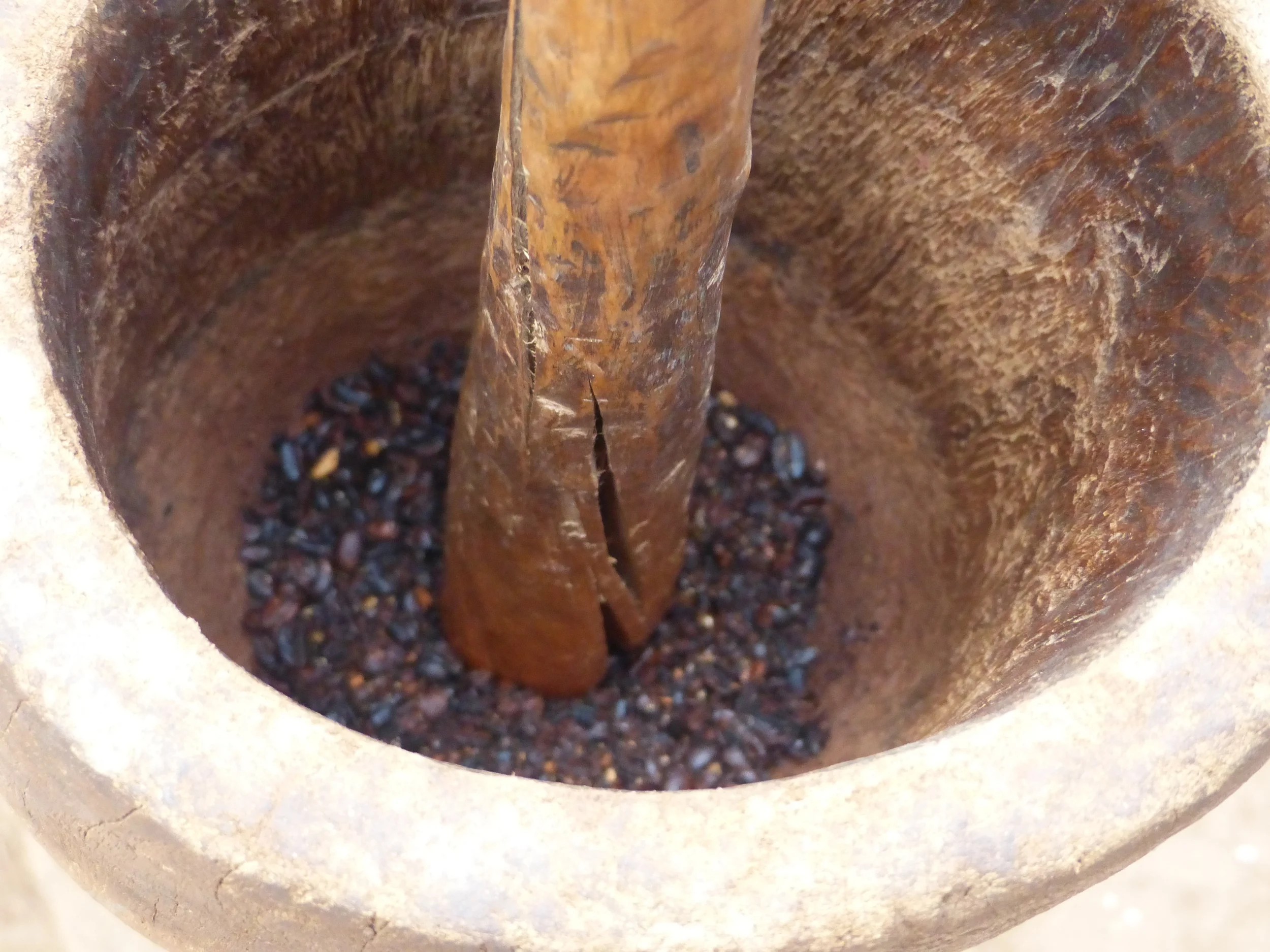 Grinding the beans old style