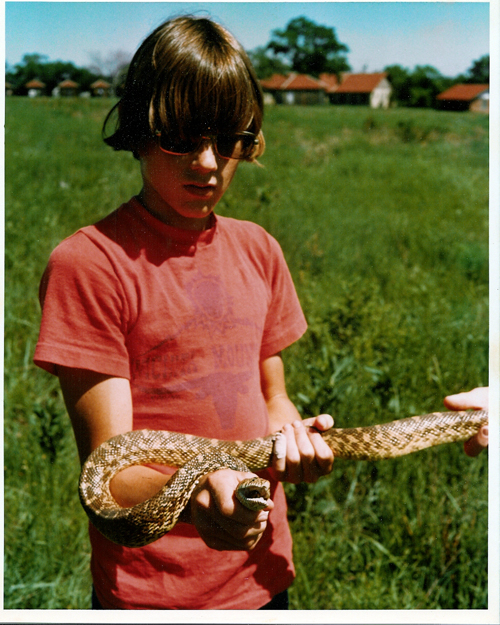 Brent, age 14, with a bullsnake in Chase County, Kansas