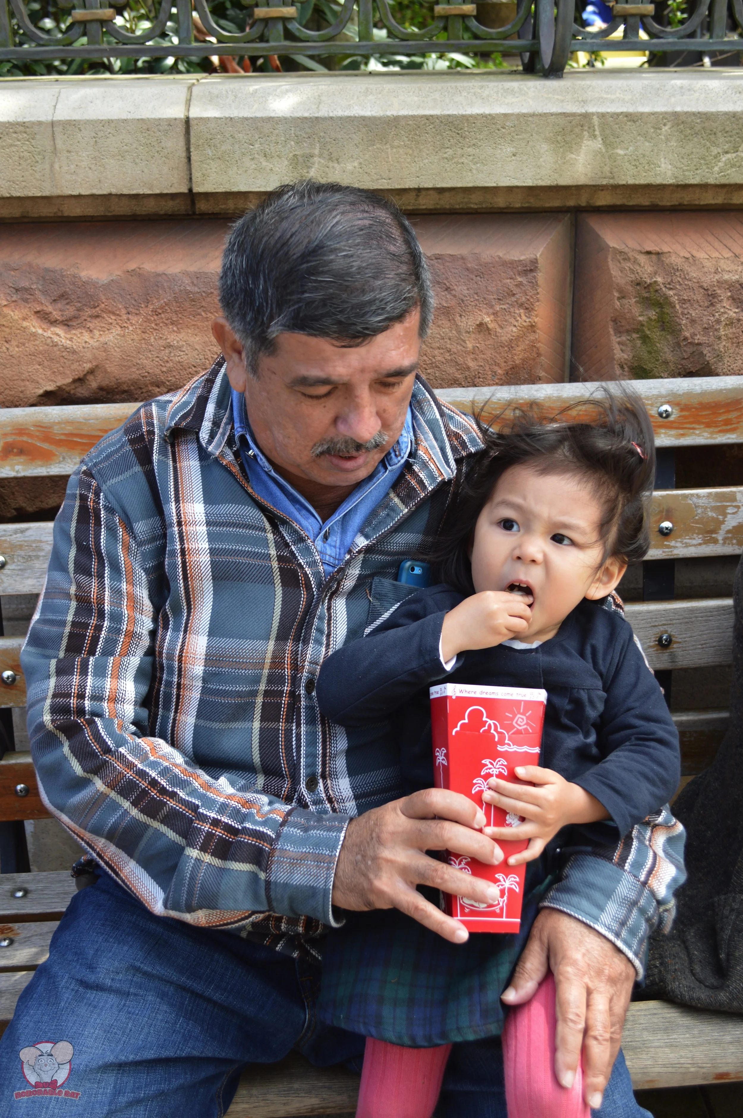 Little Mahina showing her Grandpa how much she loves popcorn