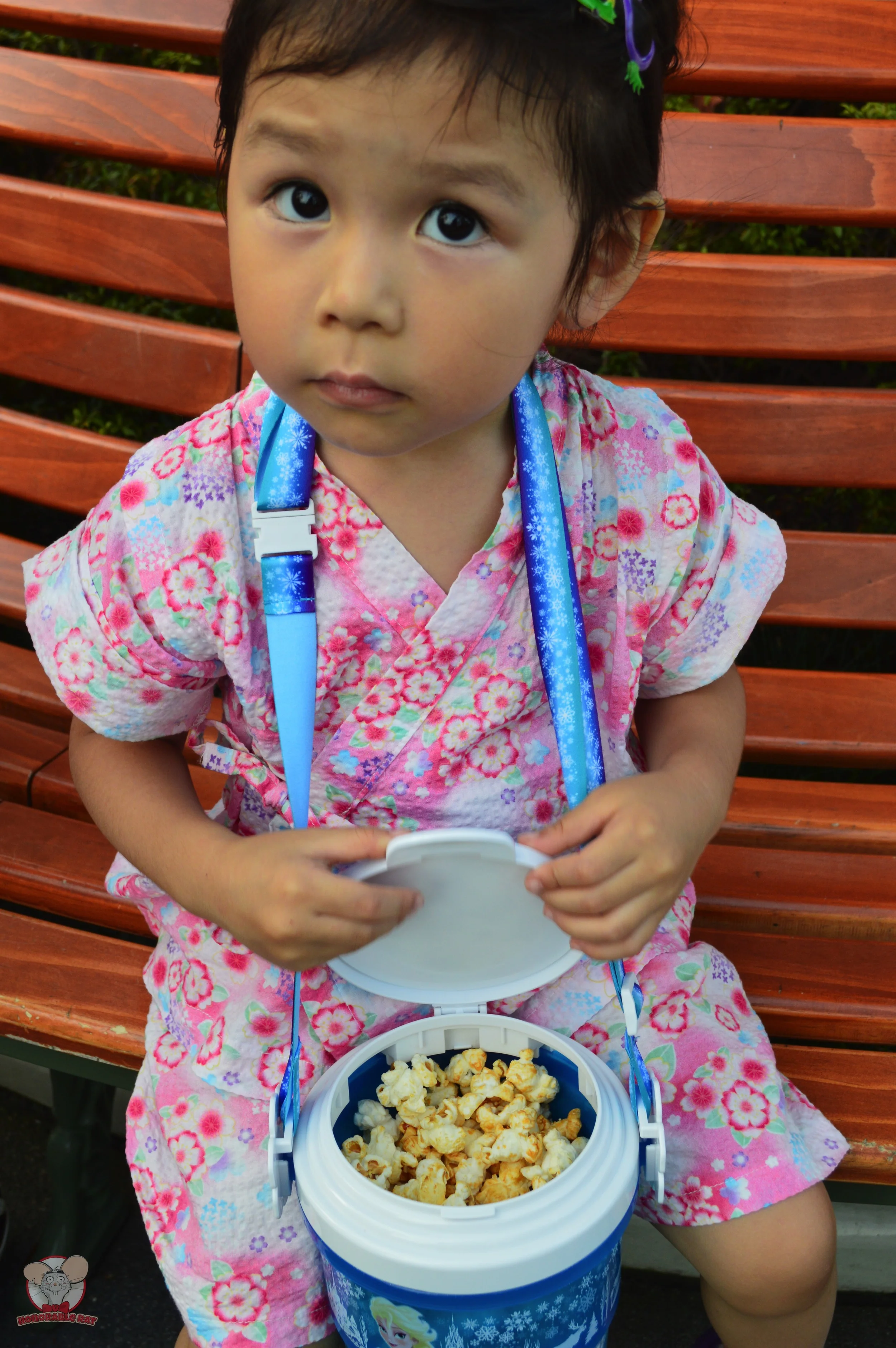 Little Mahina opening the popcorn bucket