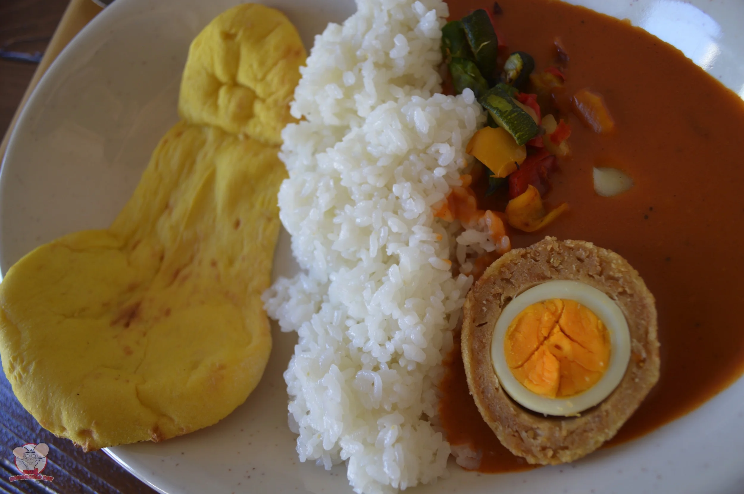 Butter Curry with Chicken-Scotch Egg and Vegetables Served with Rice and Naan