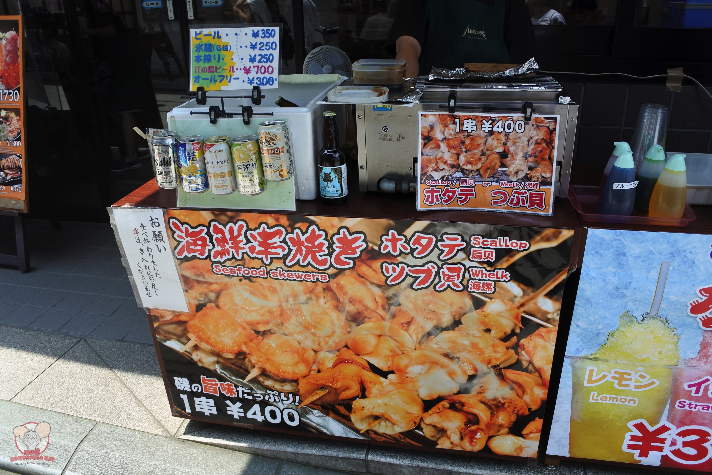 Stall outside Harumi Shokudou selling Seafood Skewers