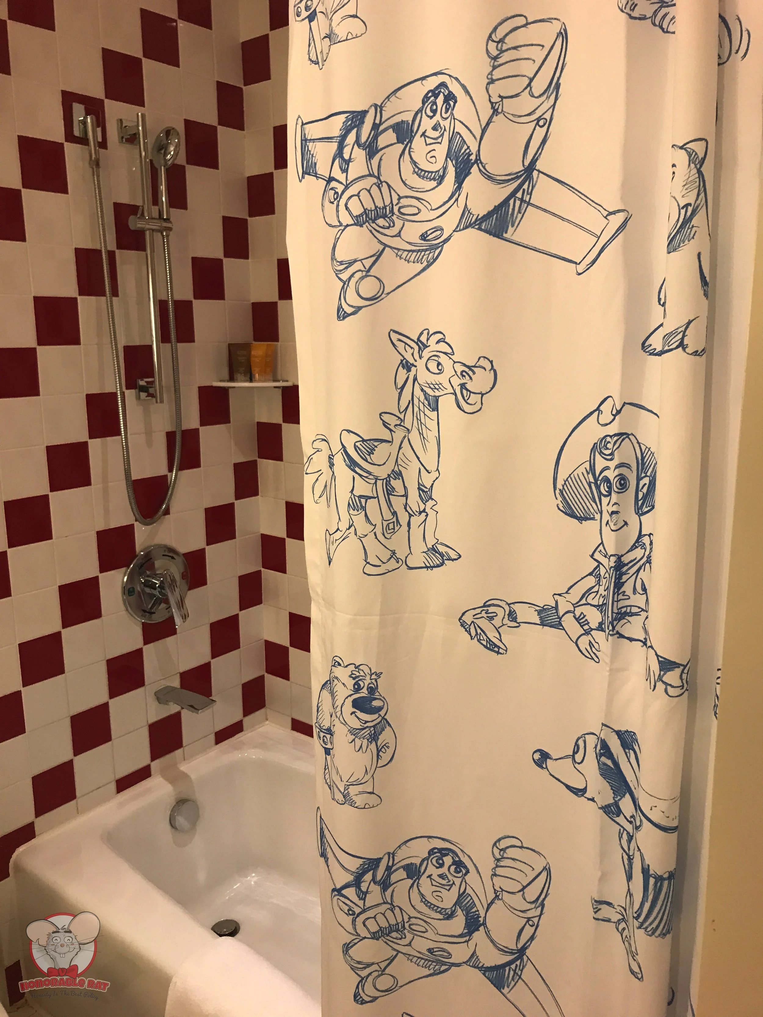 Closer look at shower curtain and bathtub