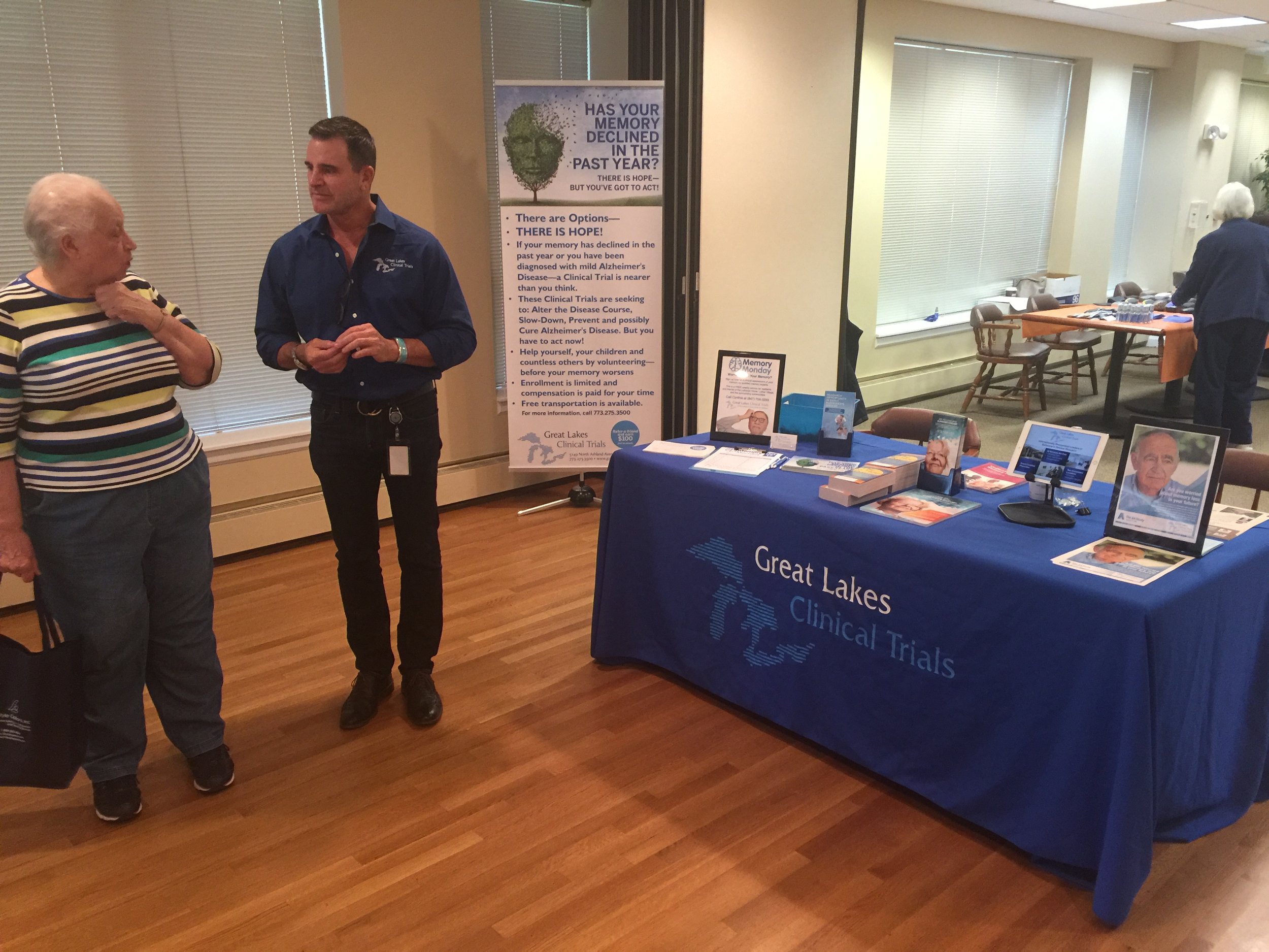 Dean Hervochon, Co-Founder of Great Lakes Clinical Trials, meeting with a local senior
