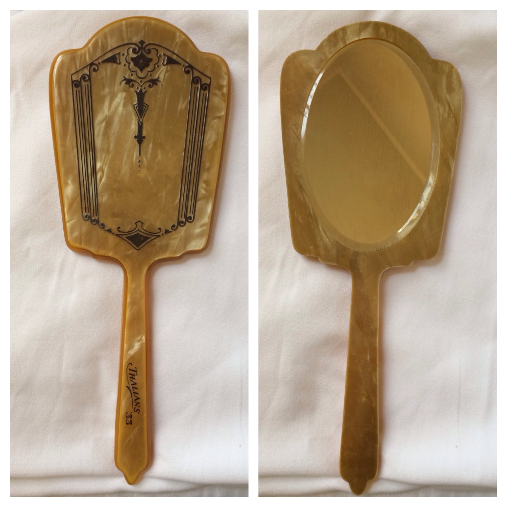 1933 Hand Mirror. Celluloid. 5″ w x 13″ h. Value: $60.