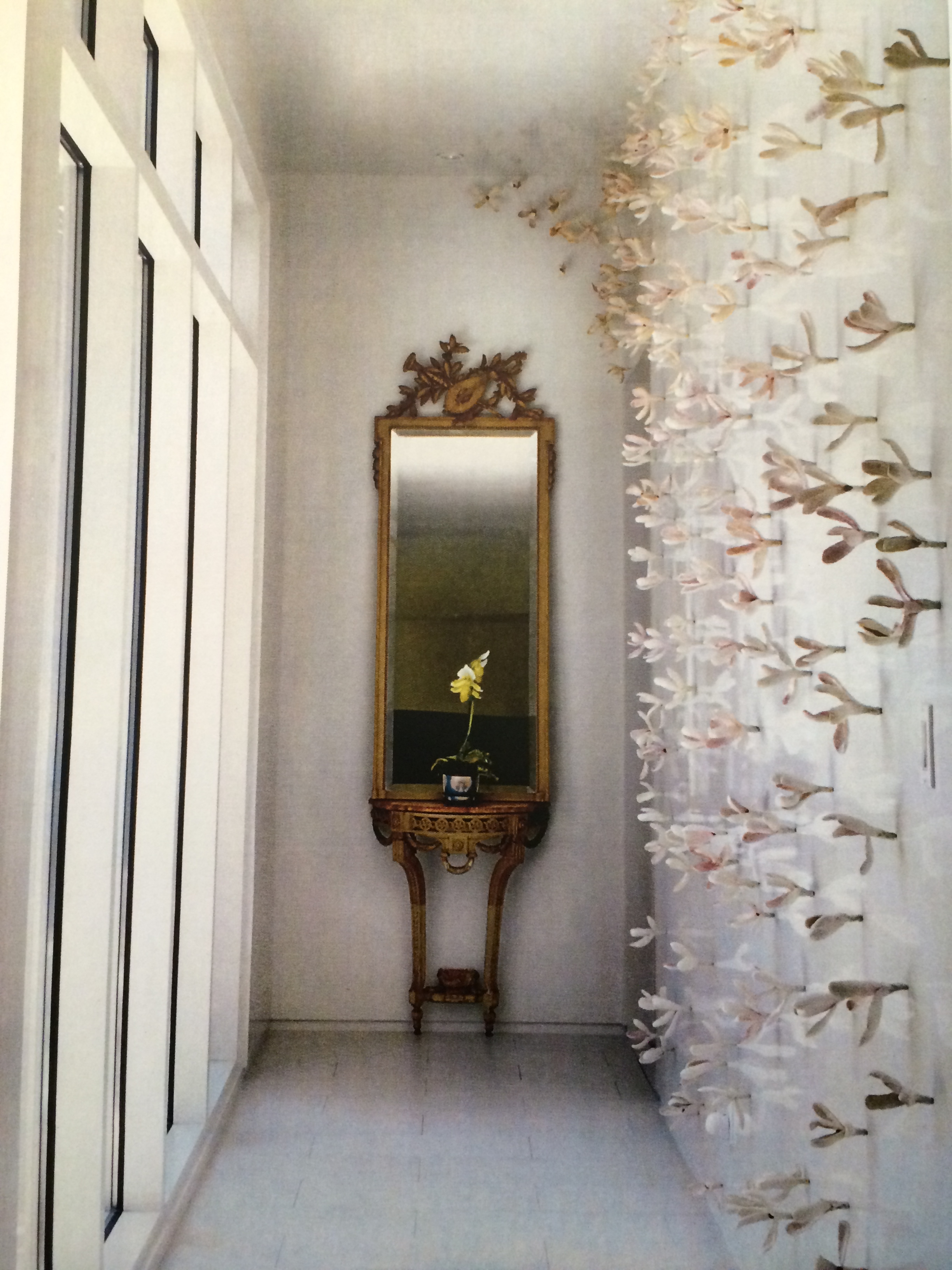 Japanese Magnolia wall installation. Bradley Sabin. 16 pieces glazed ceramic magnolas with steel screws. Value: $600.00. 