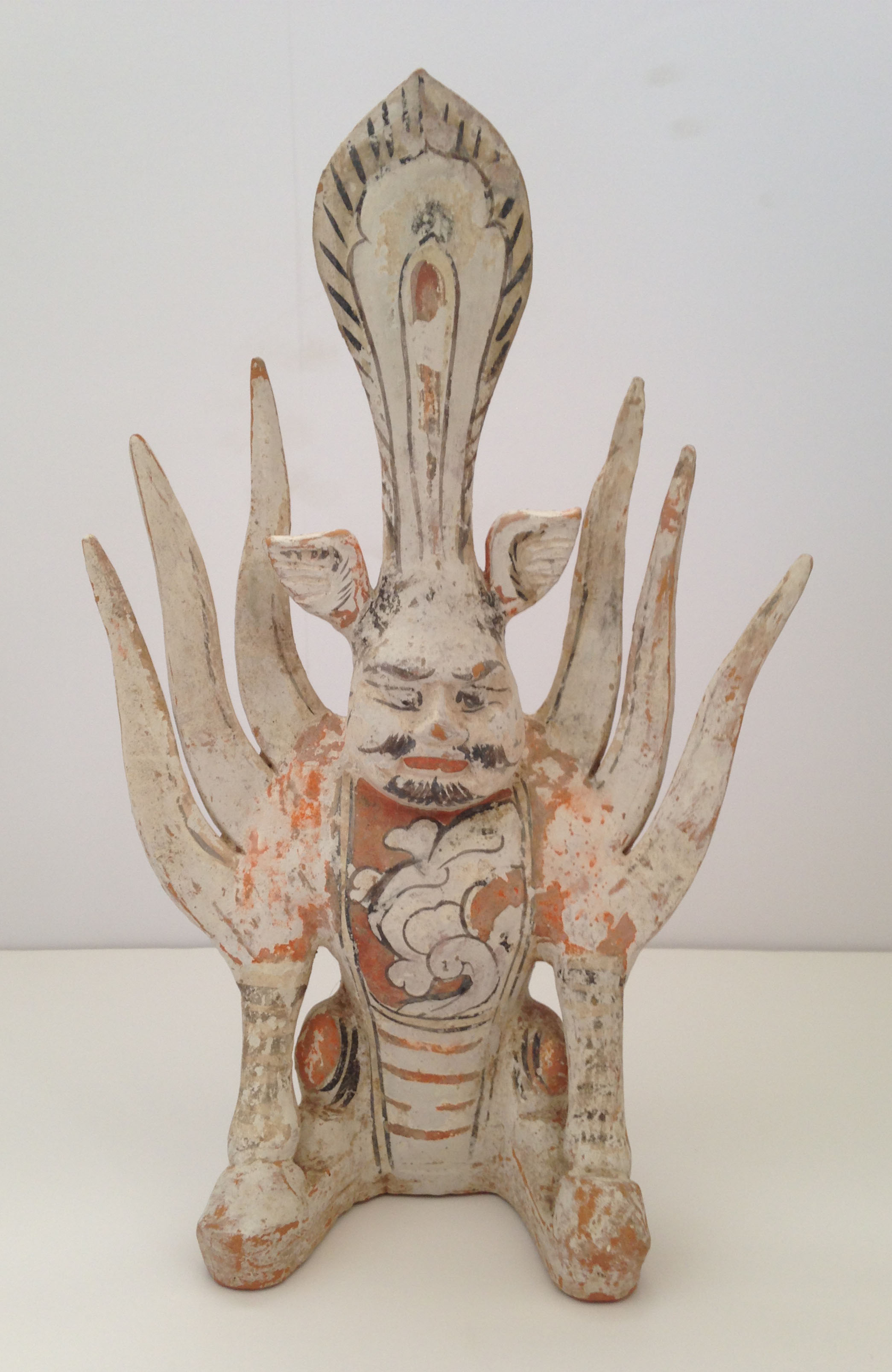 Painted pottery figure of a Chinese Earth Spirit, Tang Dynasty 618-907 A.D., 13.5"X9"X4.25", value: $1,500-$3,000 (Donated by Steve Clayton)
