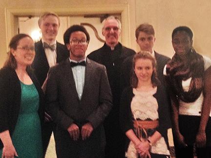 Mary Beth May, Thomas Viancort, Evan Turner, Fr. Larry, Camile Rehkemper, Stefan Rehkemper and Evana James,. 