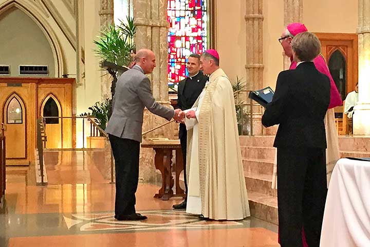 John Siebert receive the Christifidelis Award from Cardinal elect Blasé Cupich