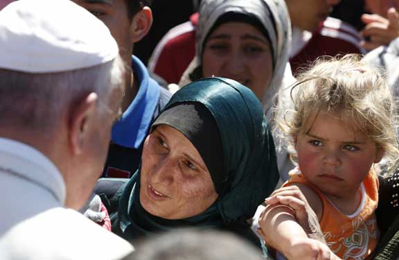Pope Francis with refugee family. National Migration Week 2017.