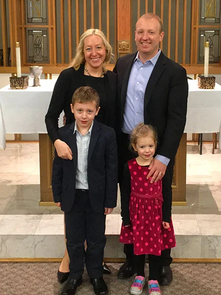 Tyler Hakala (front, left) with his family