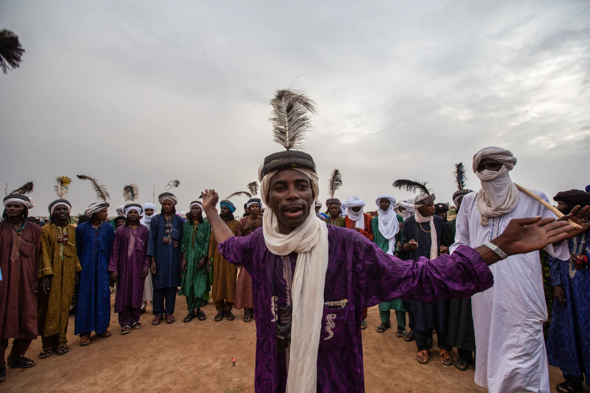 Young Wodaabe men get together to show their skills singing, dancing, and seducing the crowd.