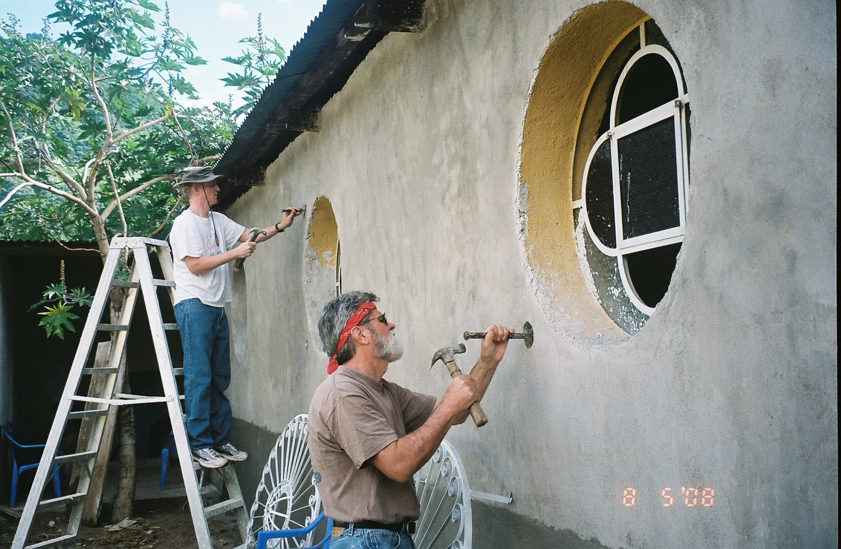 Rick and Ron installing window bars.jpg