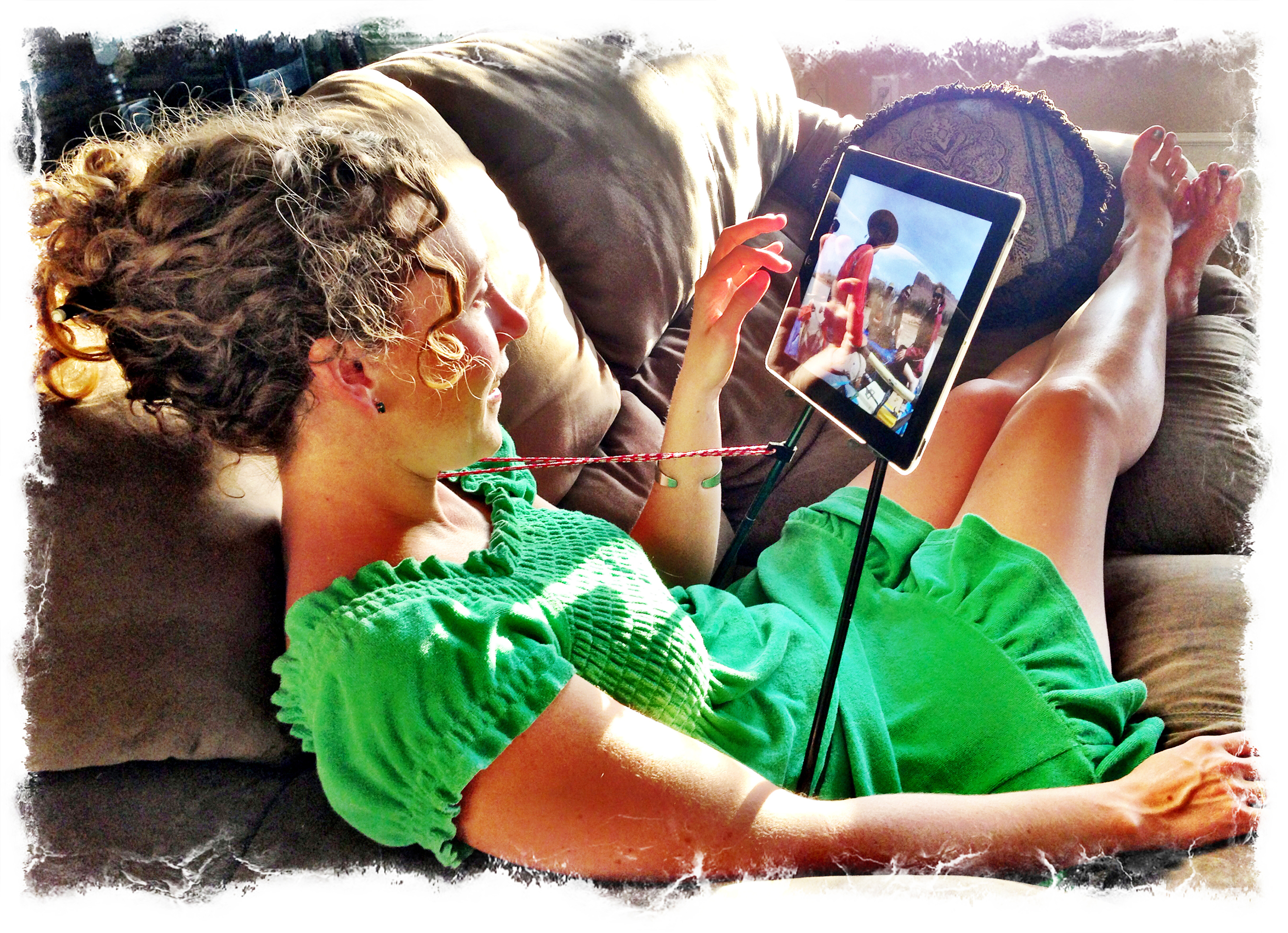 Beautiful girl using the new iPad tablet holder accessory