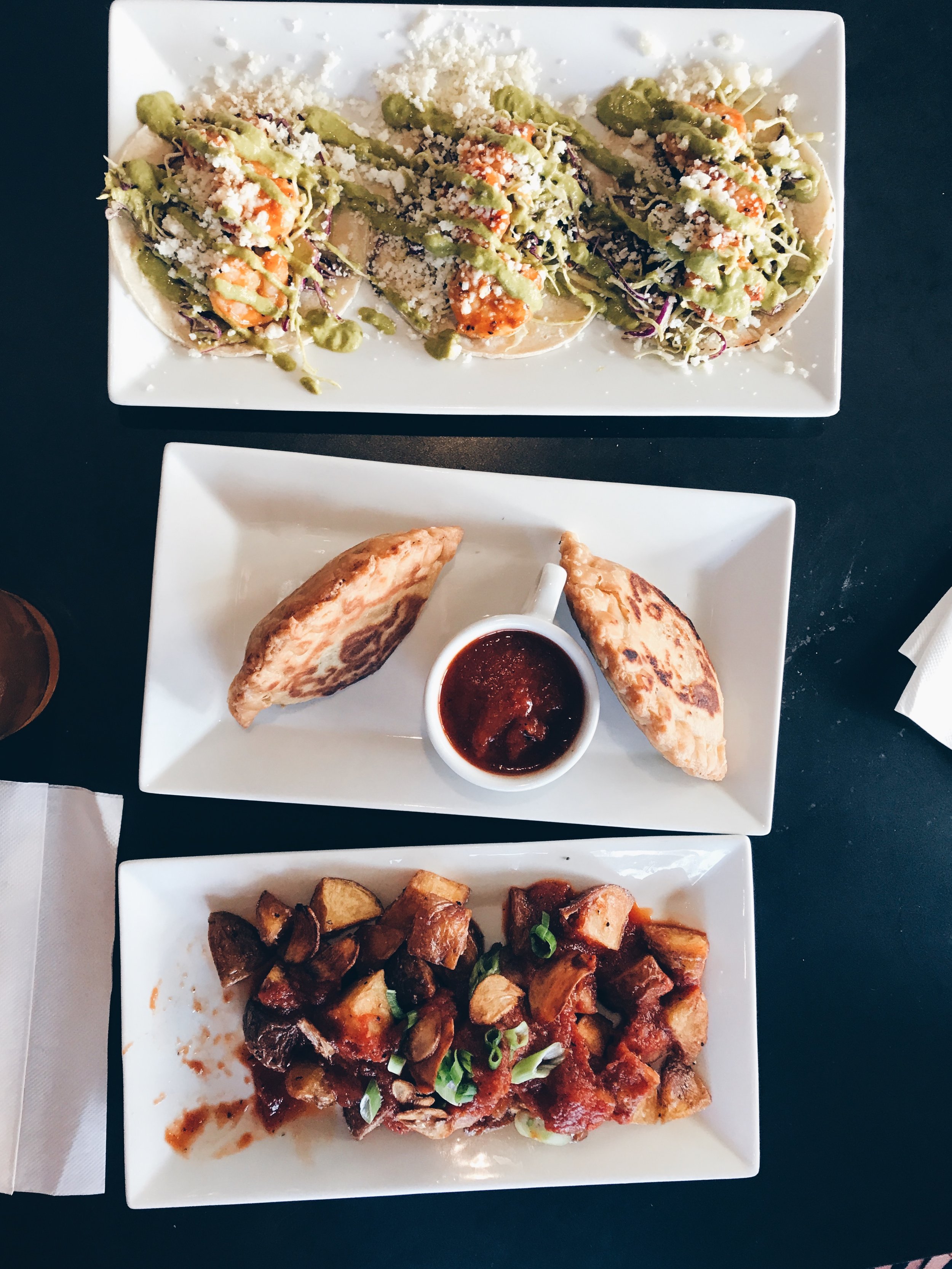 Top to bottom: Spicy Shrimp Tacos, Beef and Chicken Empanadas, Patatas Bravas