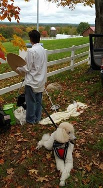 New Hitchcock art instructor, Laura Cenedella, with her assistance dog, Crystal, enjoy Plein air painting time at a farm.