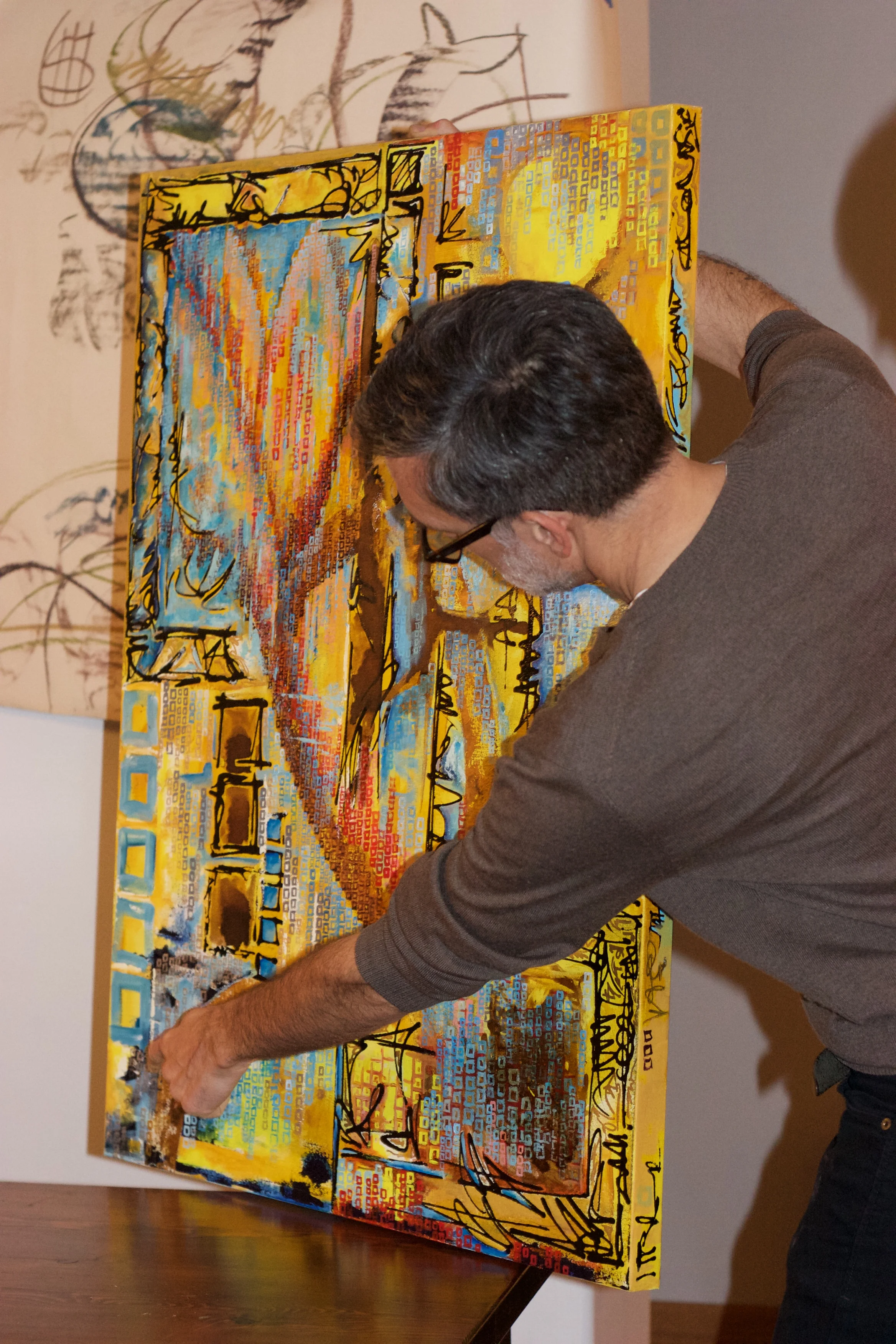 Scott Burnett illustrating a point via one of his paintings.