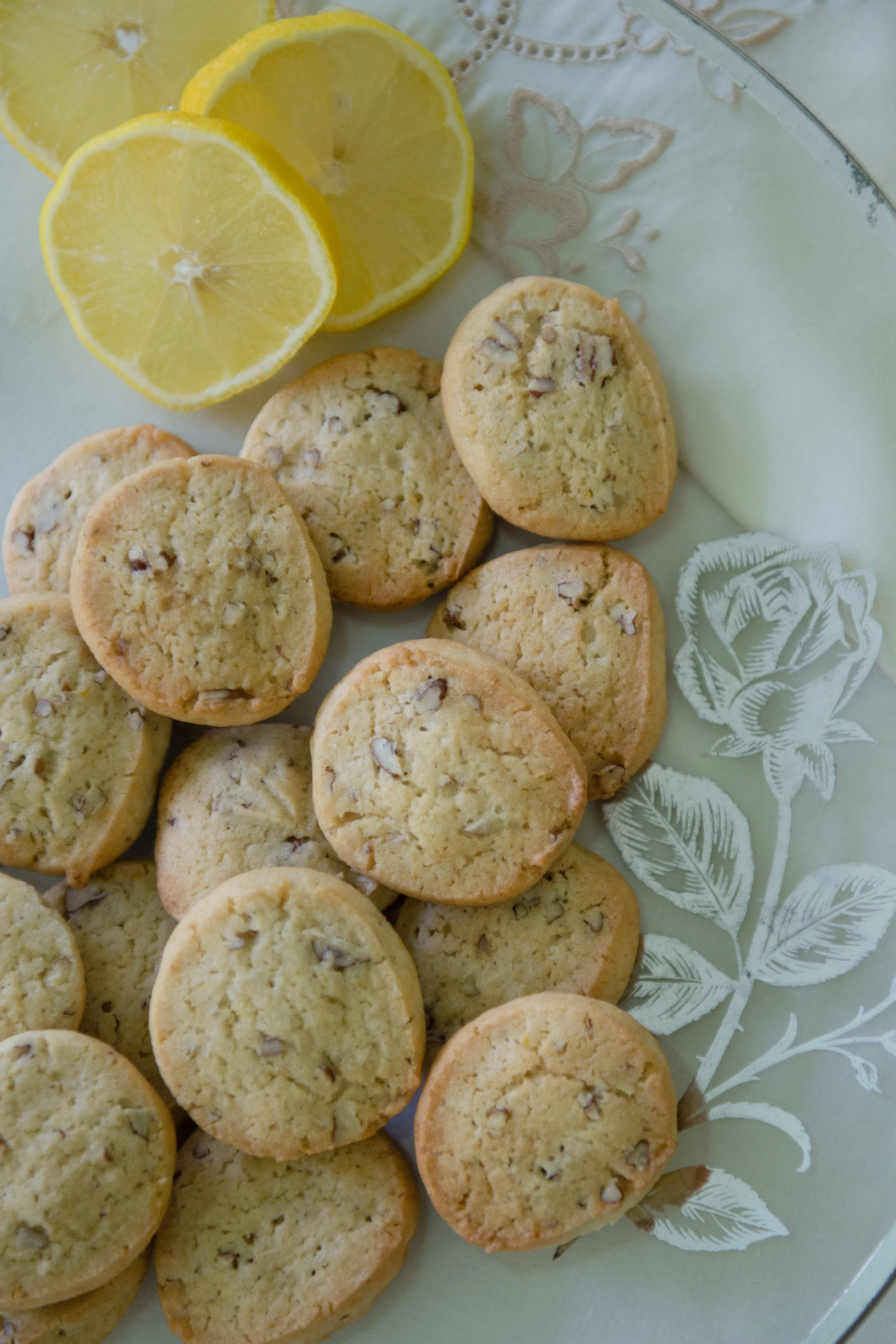 Lemon icebox cookies, made from a recipe that belonged to Lucille Burton, on a platter and with a linen napkin that both also belonged to Burton.