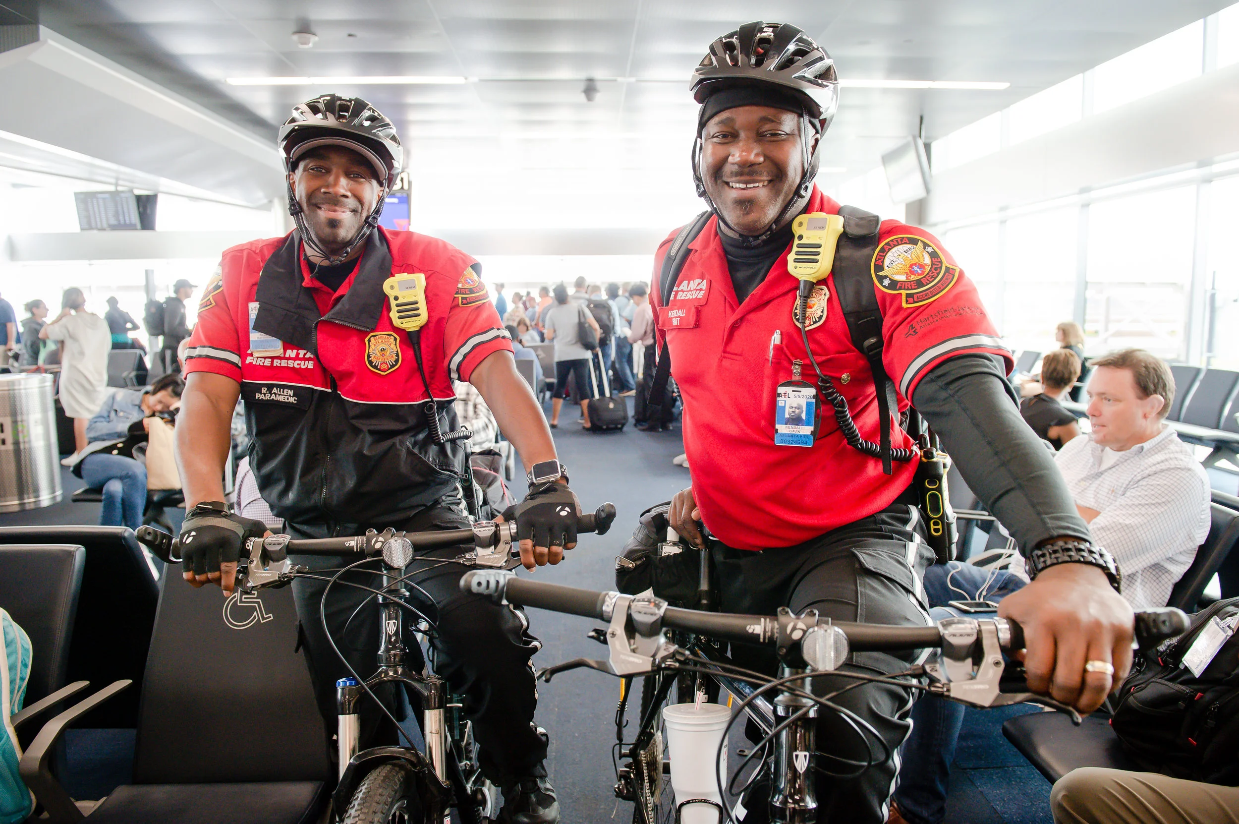 (From left) EMS Bike Medics Rayshawn Allen and Kendall Gavin pose for a photo at the far end of Concourse B at Hartsfield Jackson Atlanta International Airport Friday, 28 Sept. 2018.