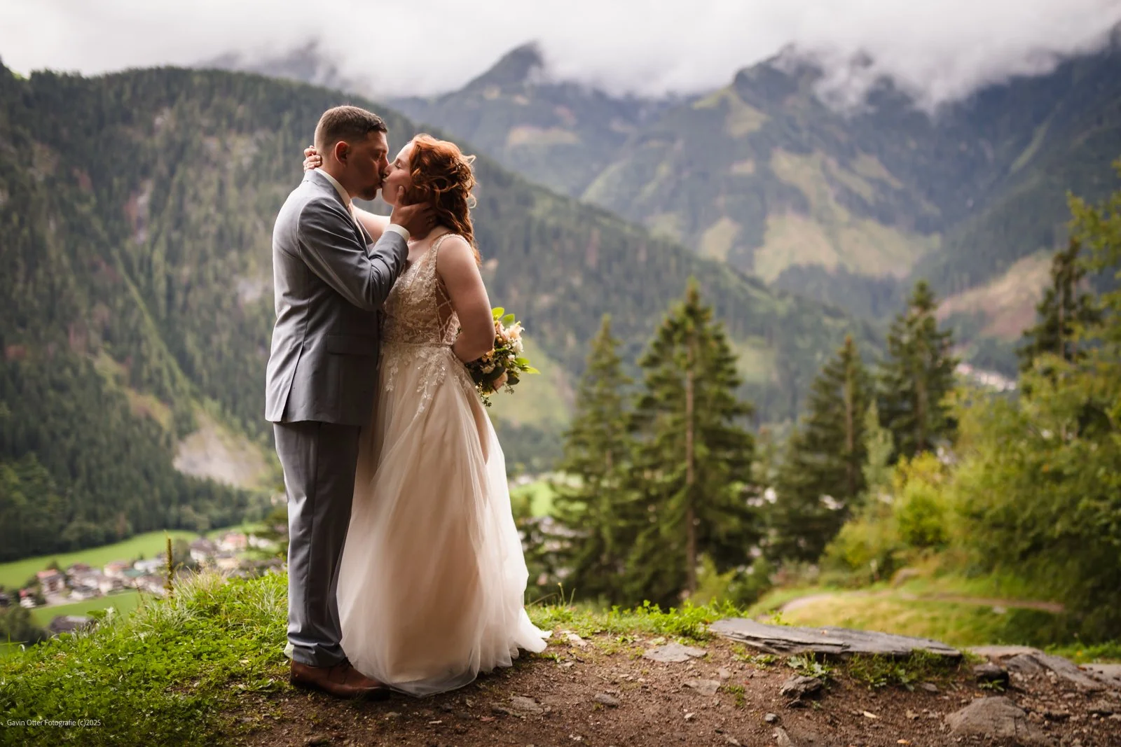 bridal couple with cloudy mountains