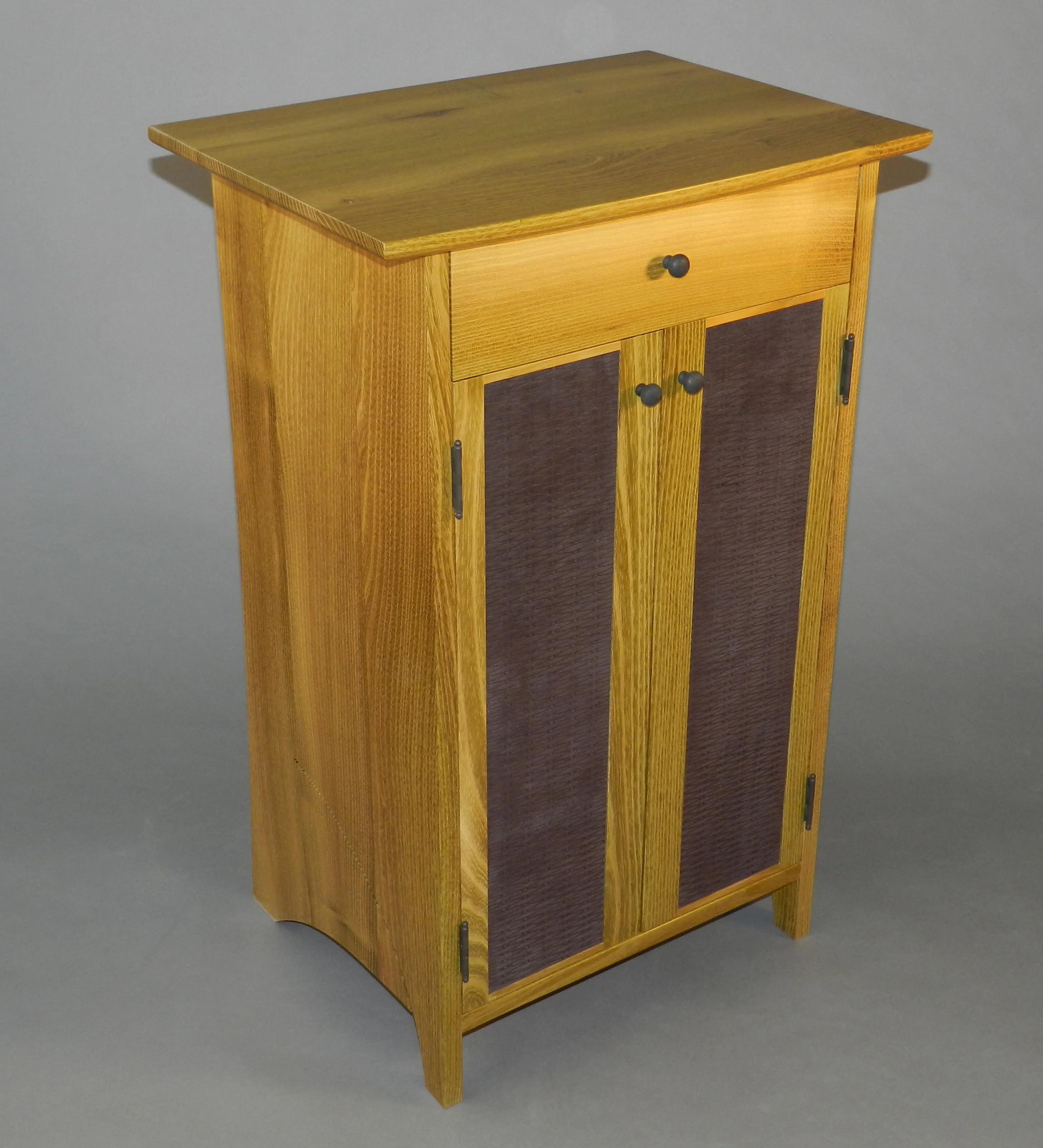 Fumed black locust cabinet with embosed suede panels