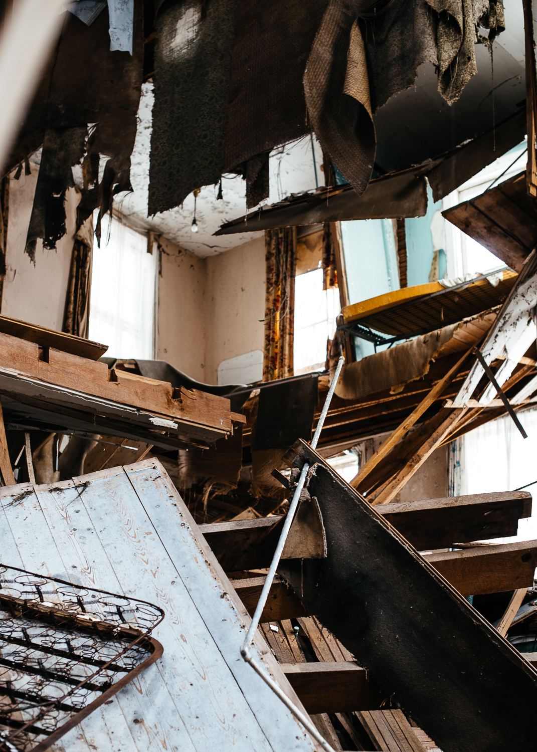 Floor joists have given out revealing 3 stories of the building. 