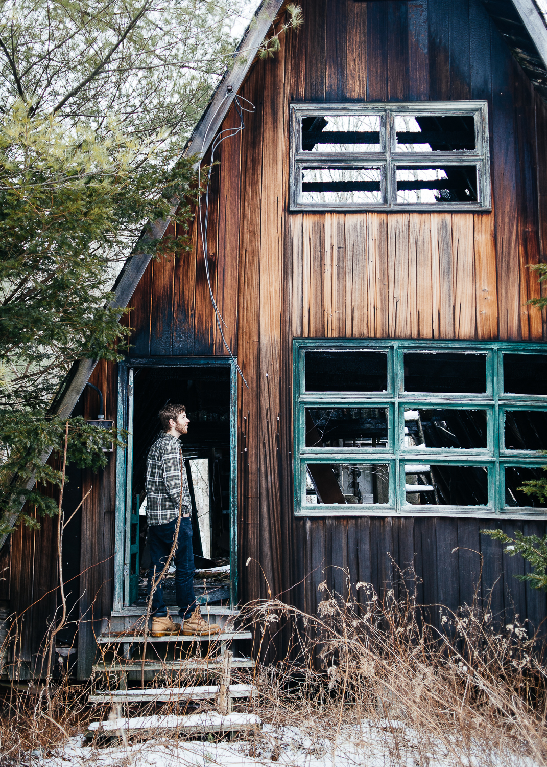 Adam checking out a burned out A-Frame house.