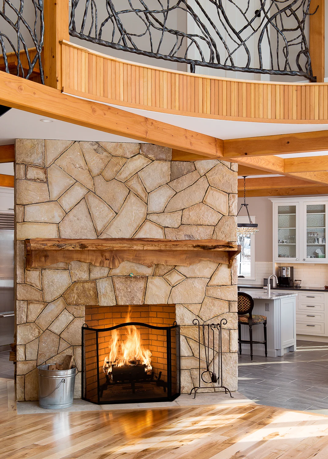 Fireplace separating the living area from the kitchen.