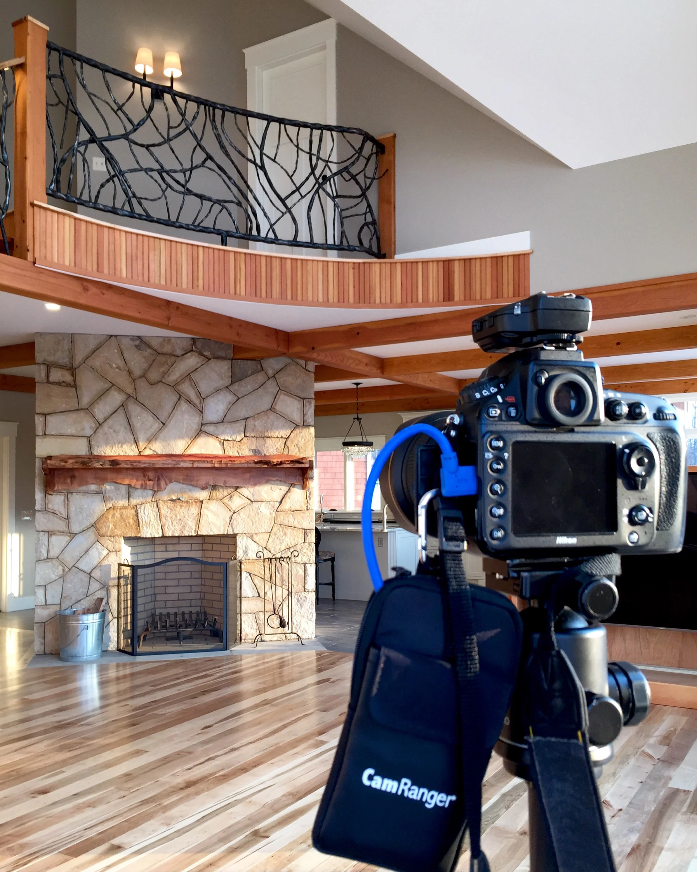 Behind the scenes, shooting the living room. Note: there was no fire in the fireplace at this point and that was added afterwards.