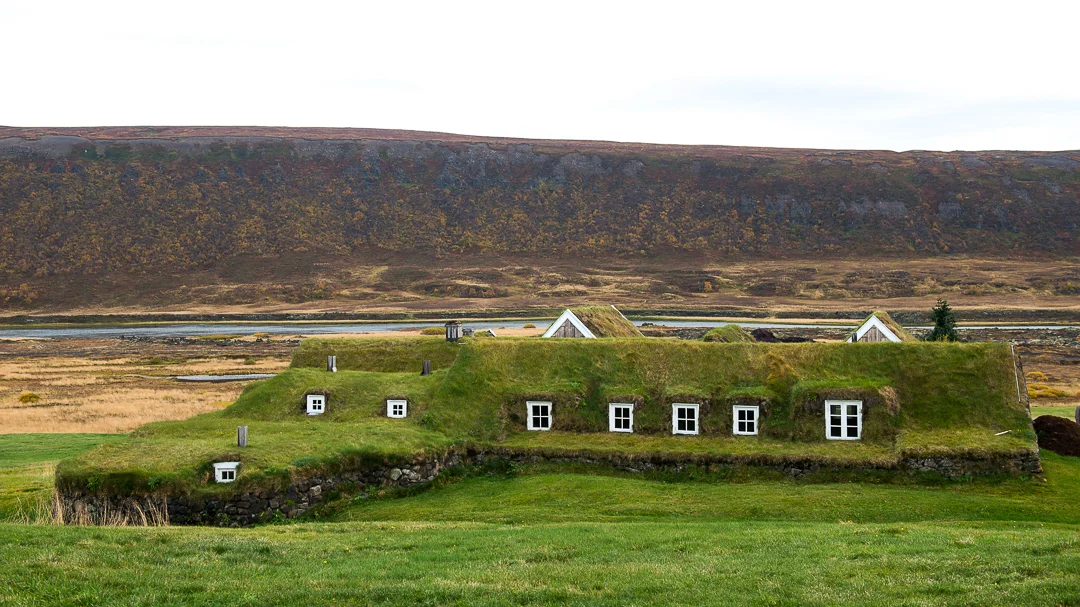 Turf house emerges out of the natural landscape.