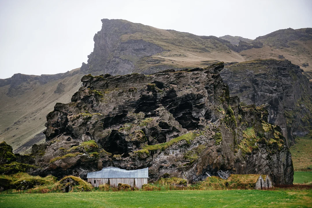 Turf house built into a rock.