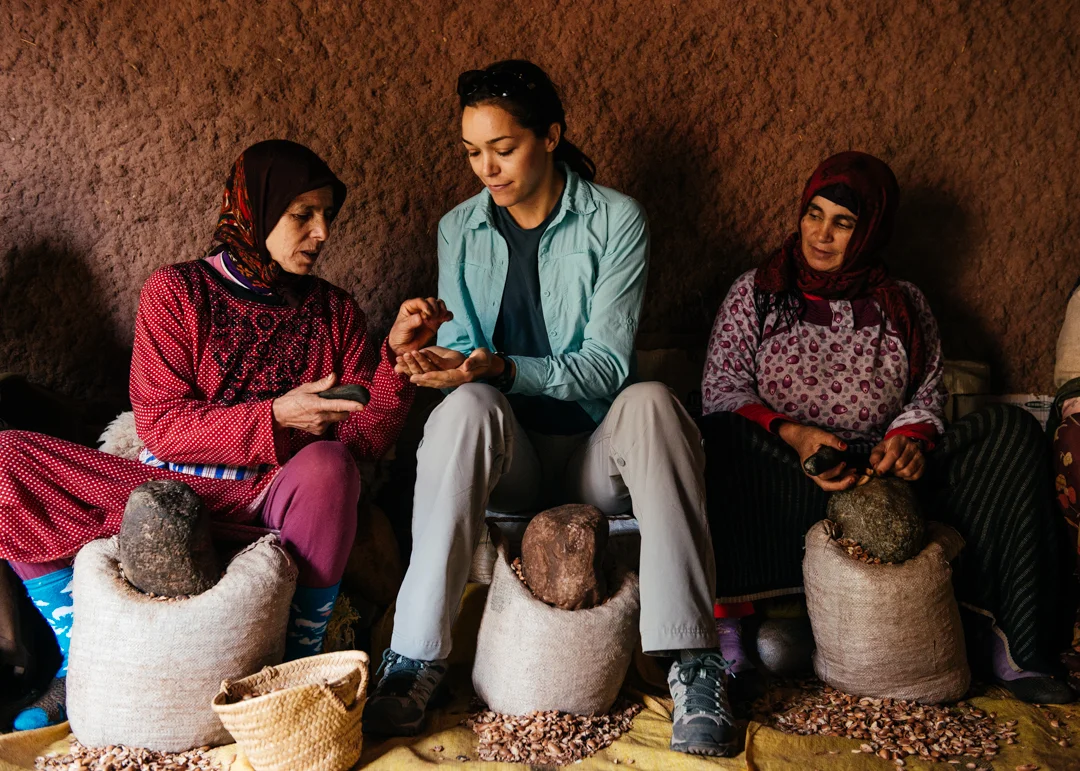 Chelsea learning how to crack the argan seeds.