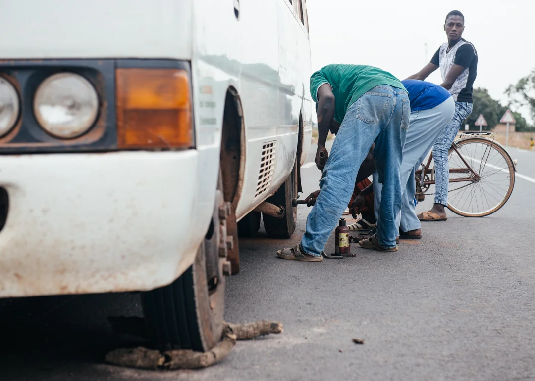 Fixing a flat tire. 