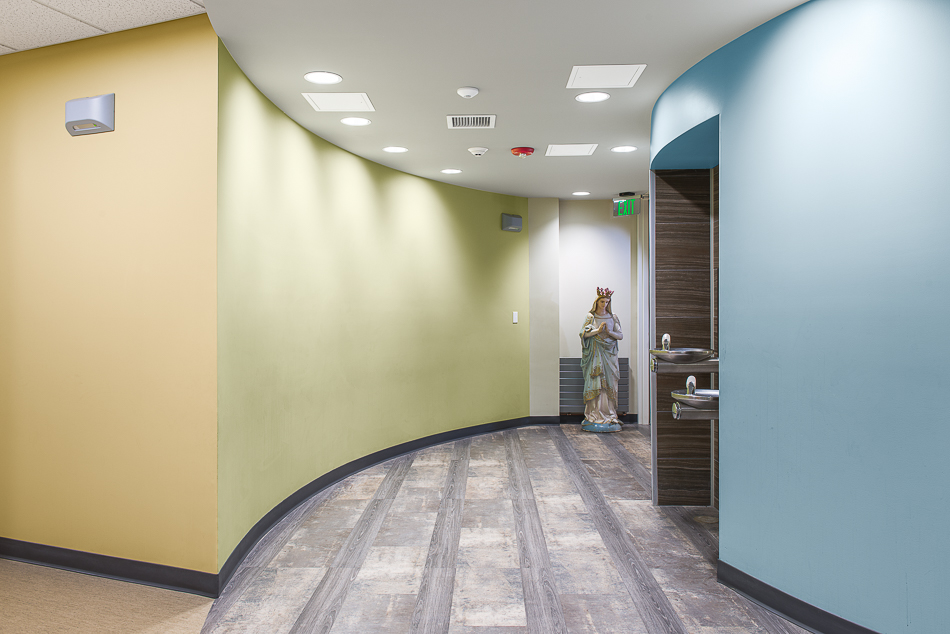 Curved hallway with a water station. 