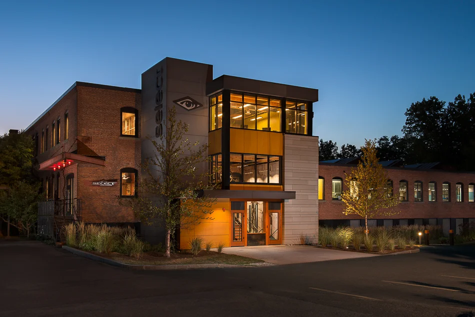 Select Design building at dusk