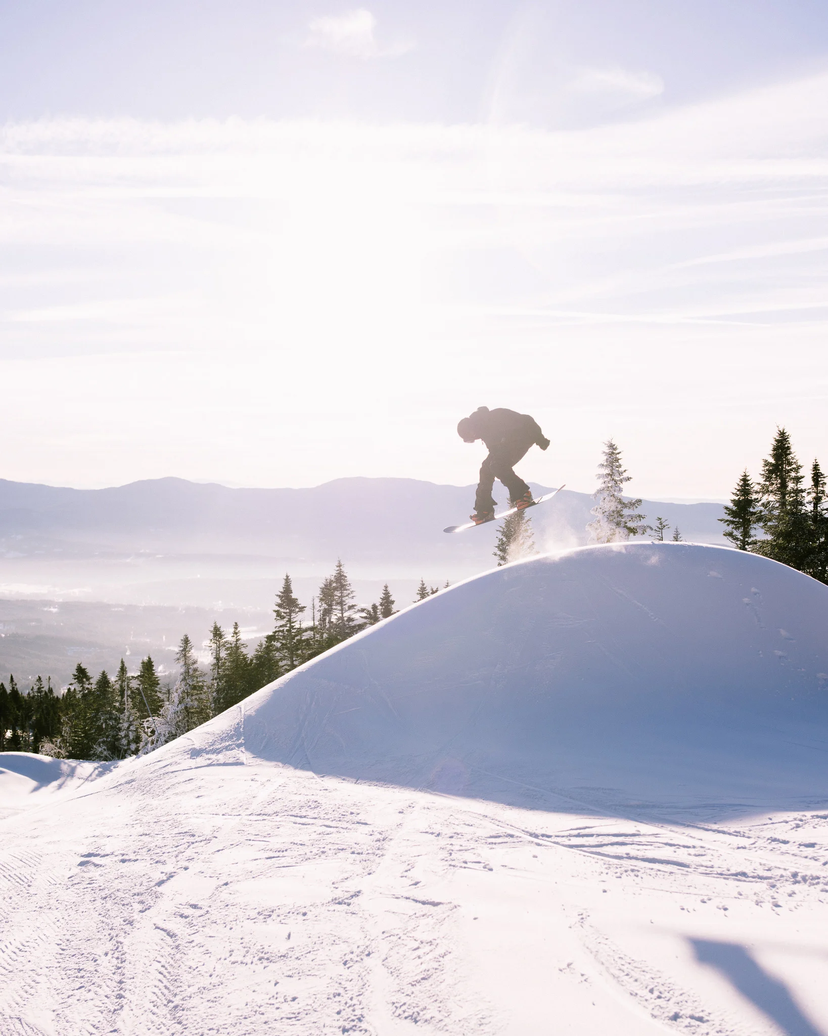 Snowboarding off wind lip