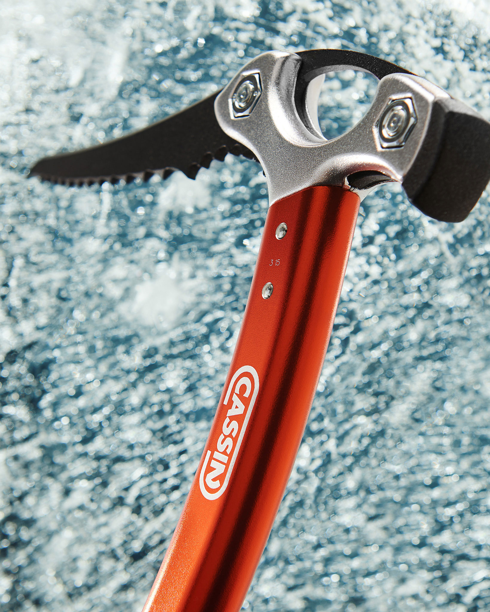 Detail of the ice axe striking the ice. 