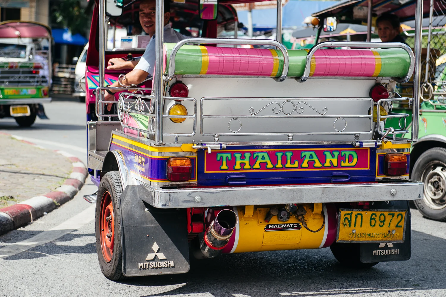 Tuk Tuk driver, the common taxi transport of Thailand.
