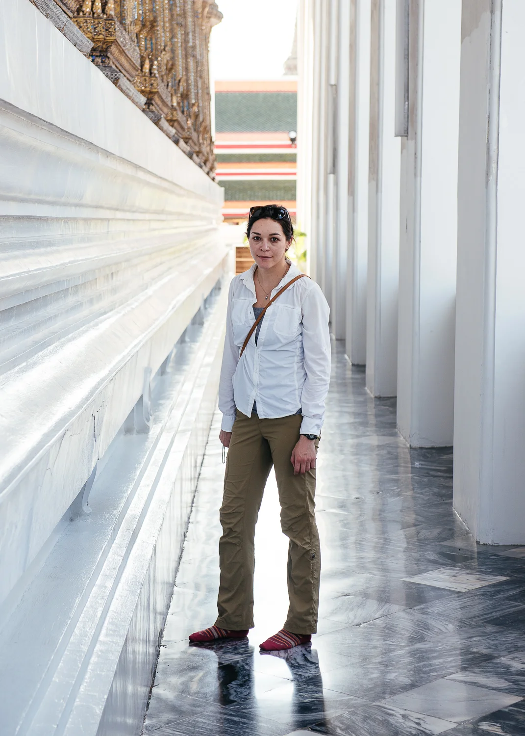Chelsea in a corridor of a wat.