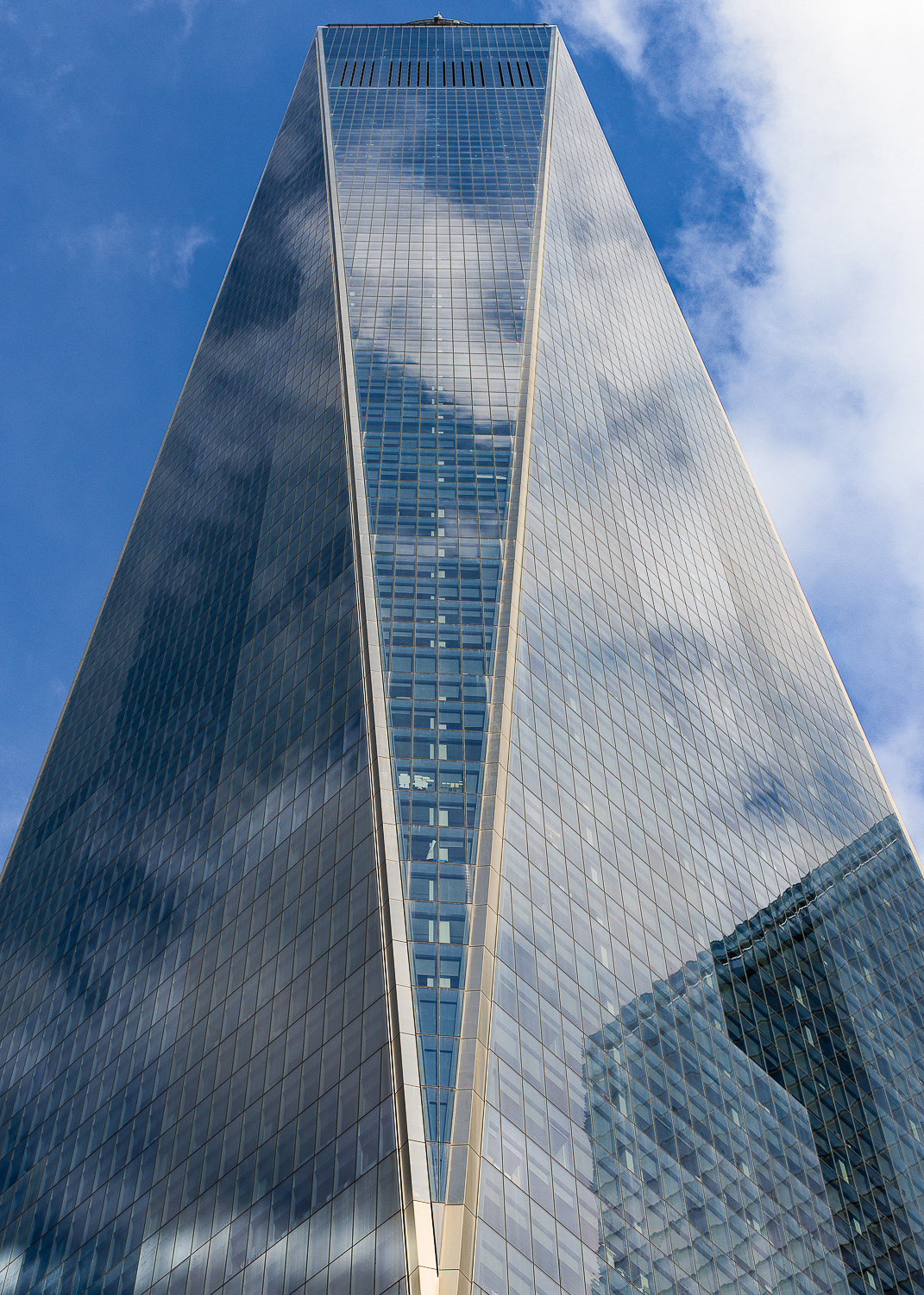 One World Trade Center - architect - David Childs. The new tower was completed in 2013 after the terrorist attack on 9/11/01 took down the original building. It is the tallest skyscraper in NYC at 1,776 ft, a deliberate reference to the year when the Declaration of Independence was signed. 