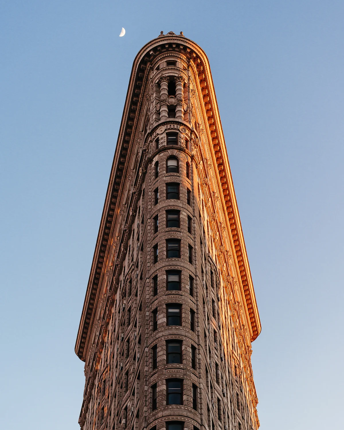 The Flatiron Building opened in 1902 as a groundbreaking skyscraper of its time. Its name derives from its likeness of a cast-iron clothes iron.
