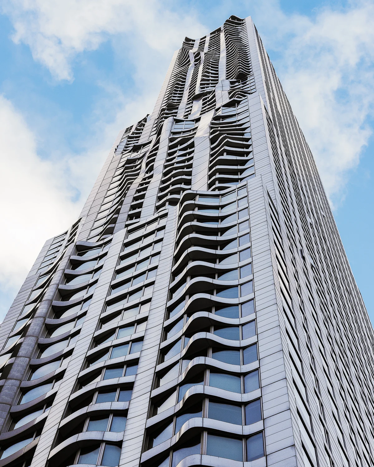 Beekman Tower - architect - Frank Gehry. Opened in 2011 as one of the tallest residential building in the world. The towers deconstructivism architecture style and stainless-steel facade undulates as if it is being blow by the wind. 