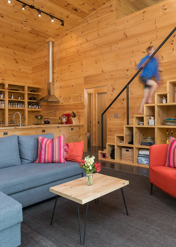 Living room with custom staircase.