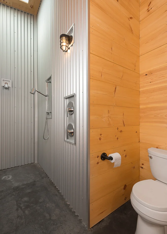 Master bathroom with corrugated metal walls. 