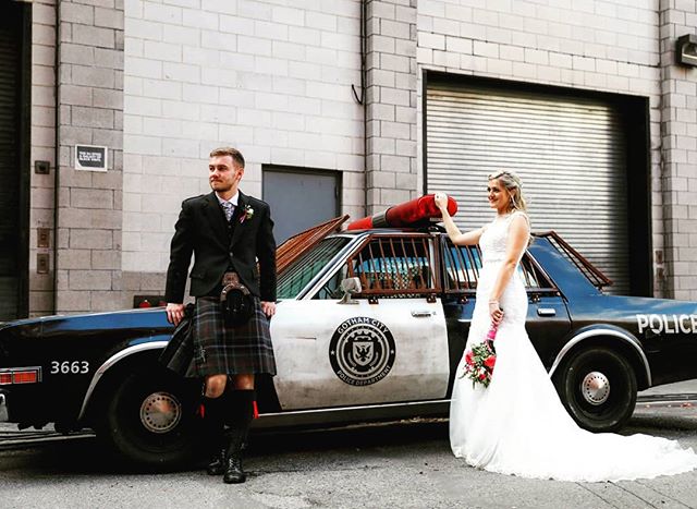 Michelle and Martin looking cool as ever in front of a Mad Max style cop car we just happened to stumble upon! You never know what you'll find walking around the streets of NYC! #copcar #brooklynbridgepark #brooklynbridge #dumbo #weddingphotographer 