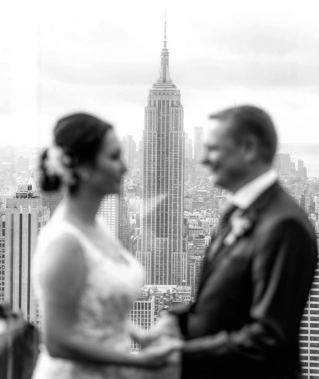 The iconic Empire State Building creates a stunning backdrop for ceremonies at Top of the Rock! #empirestatebuilding #topoftherock #weddingphotographer #wedding #weddingplannernyc #elopement #newyorkelopement #newyork #weddinginspo #elopementplanner 