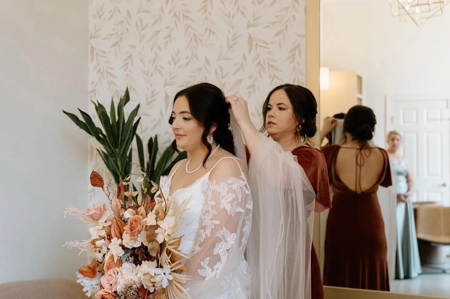 Bride getting ready with on-location bridal hair and makeup in Northeast Iowa