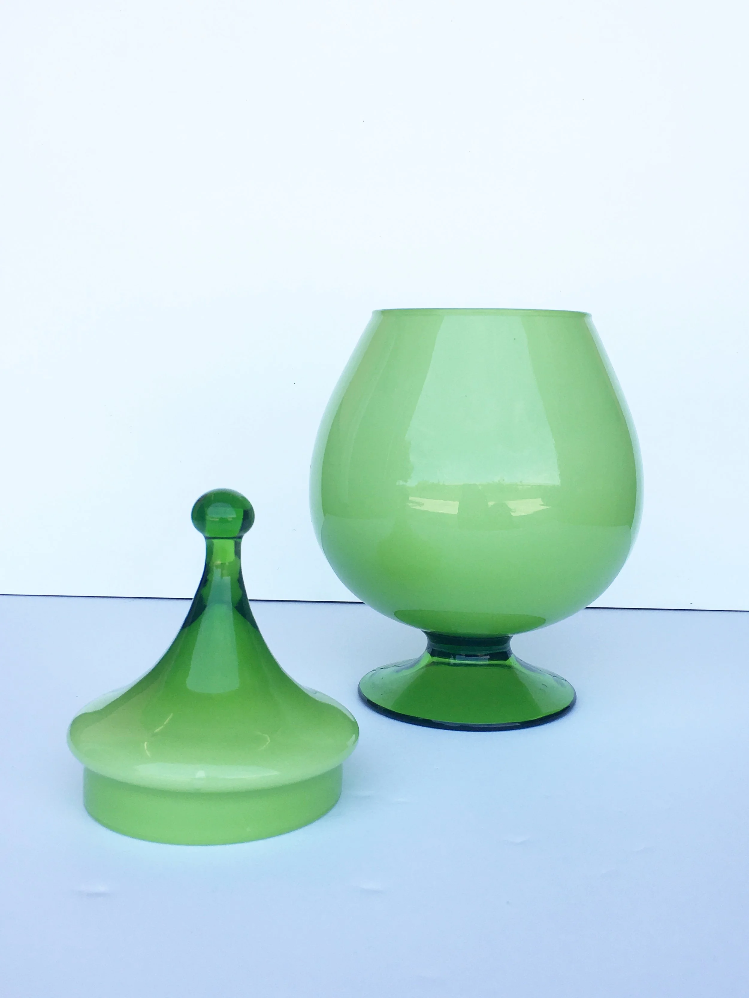 green glass vase with lid