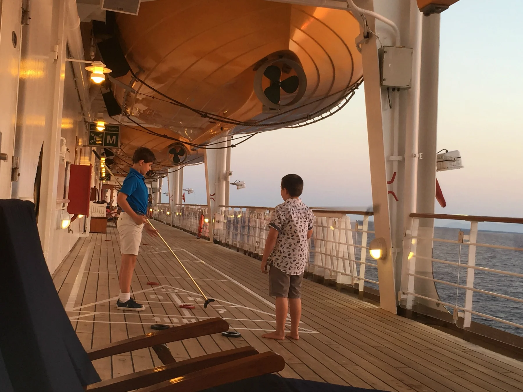 Shuffleboard with a new friend at sunset