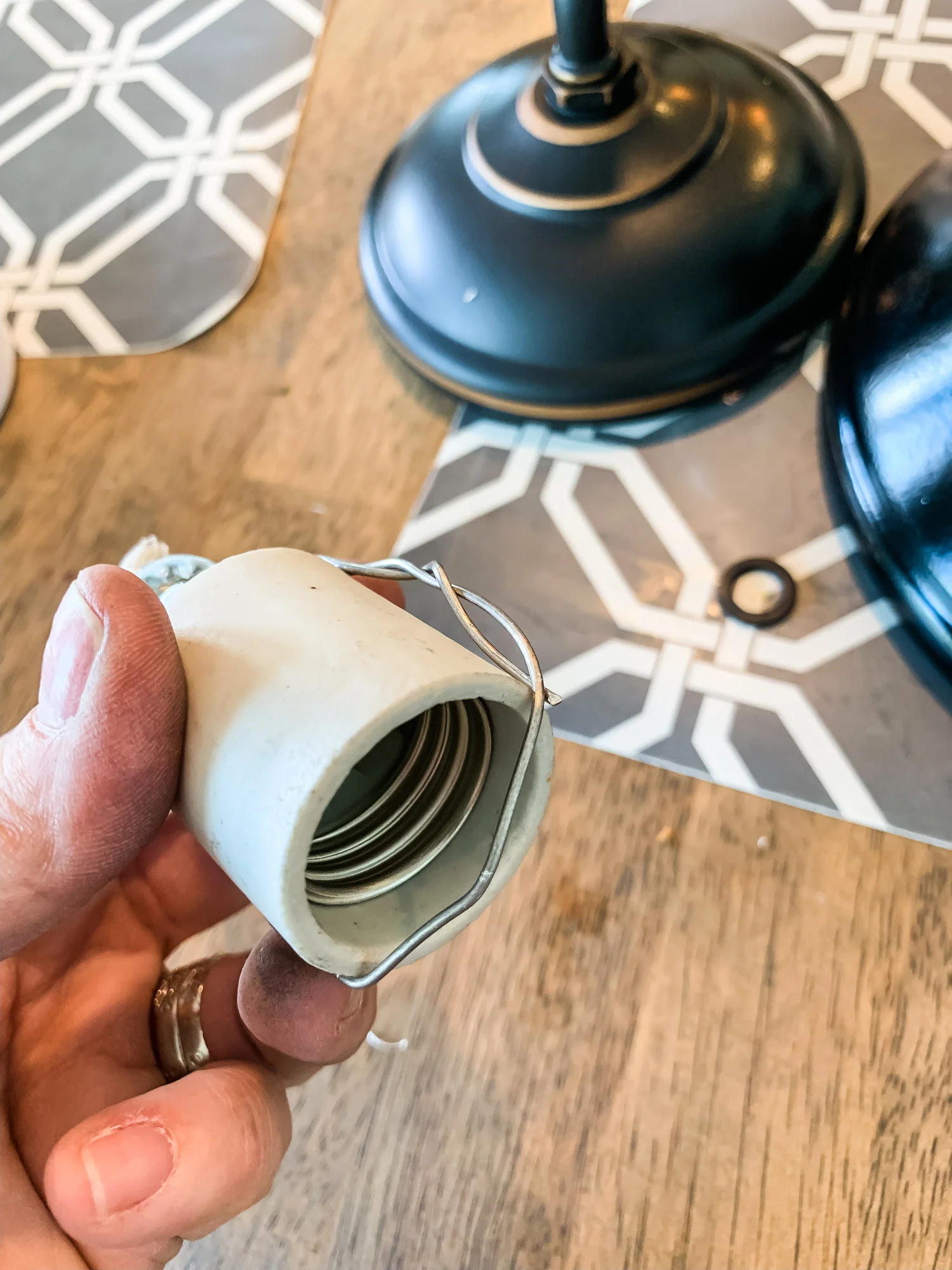 …creating a “strap” across the bottom of the light bulb casing, so your zip tie will have something to hold onto.